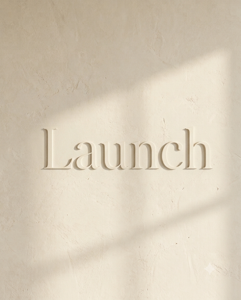 The word 'Launch' in raised, embossed letters on a light-colored textured wall with soft natural light and shadows.