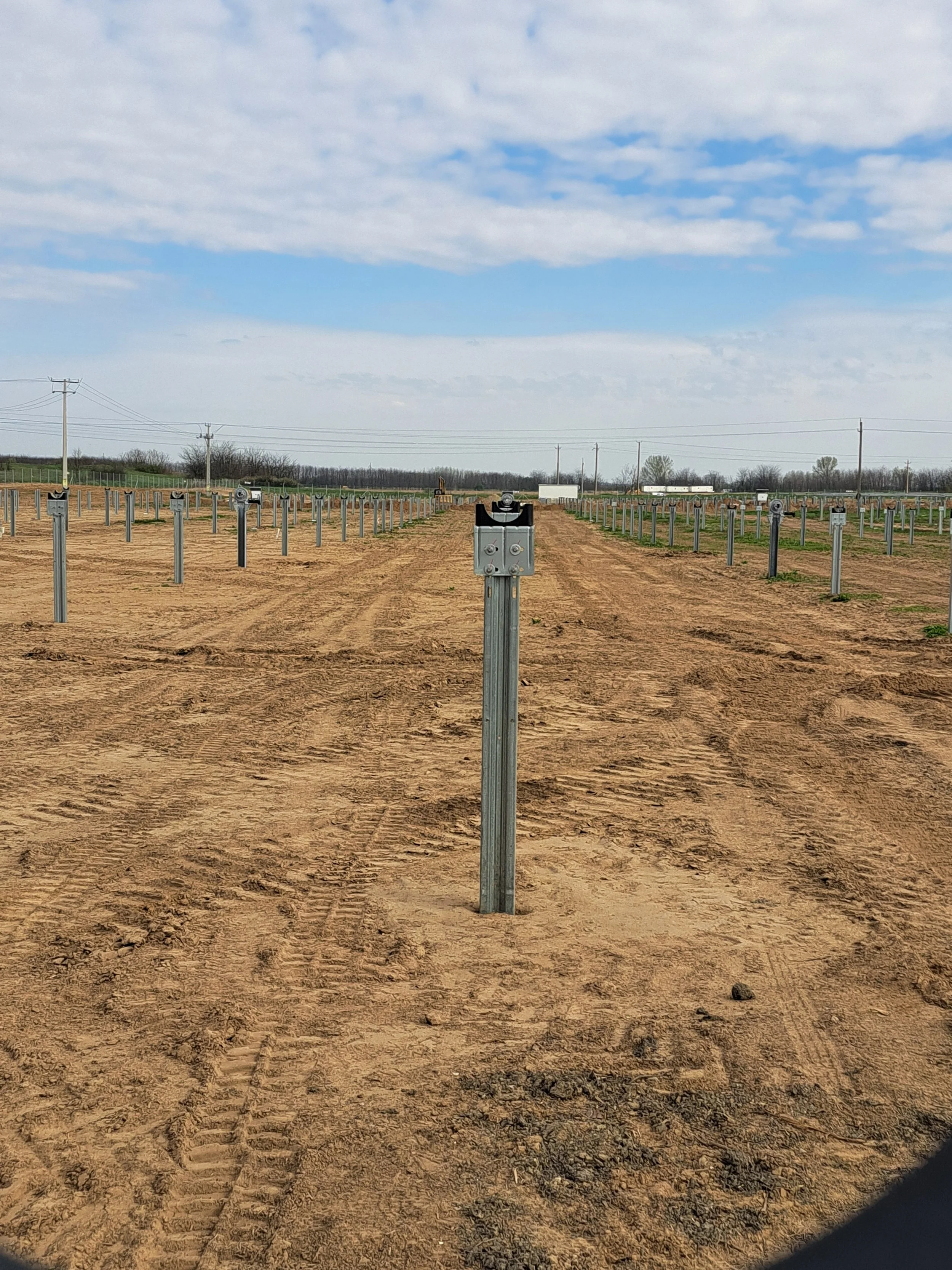 Foundation and support-post installation prepared for the assembly of photovoltaic mounting systems.