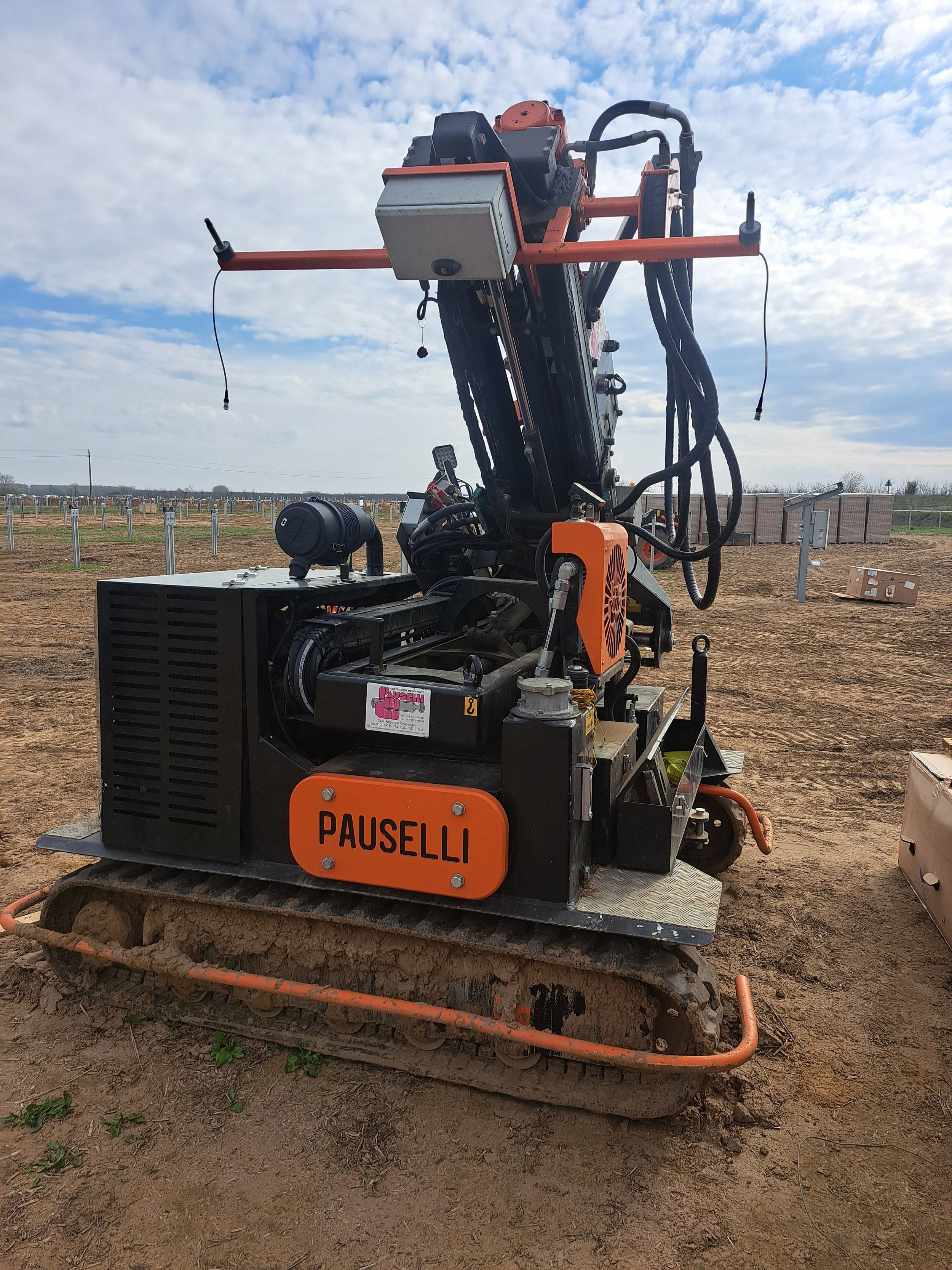 Specialist equipment supporting pile-driving and structural preparation for solar construction.
