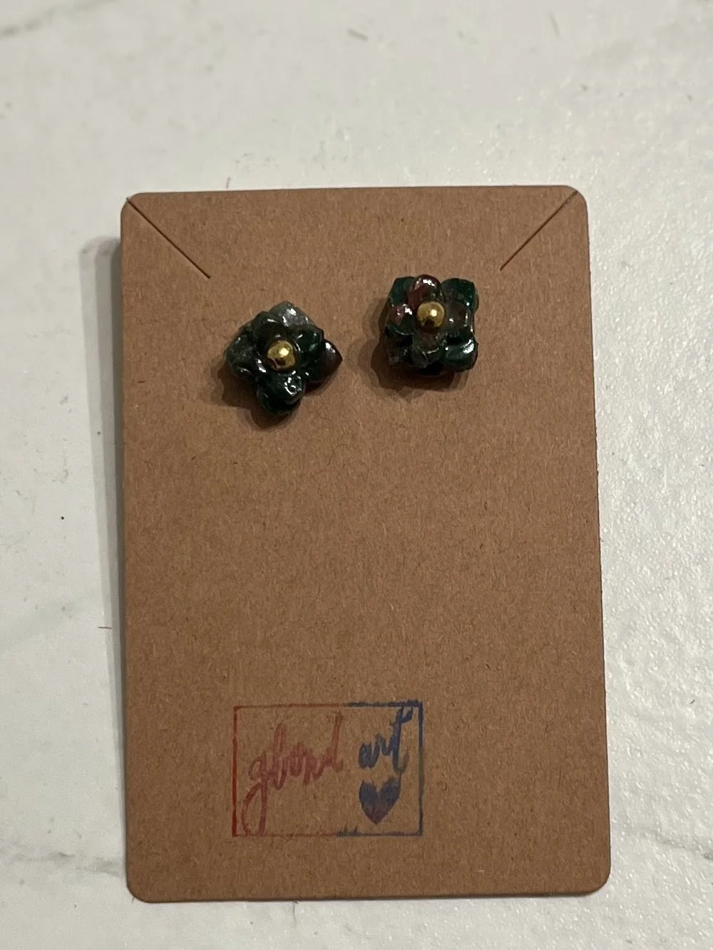 Dark green flower studs.jpg
