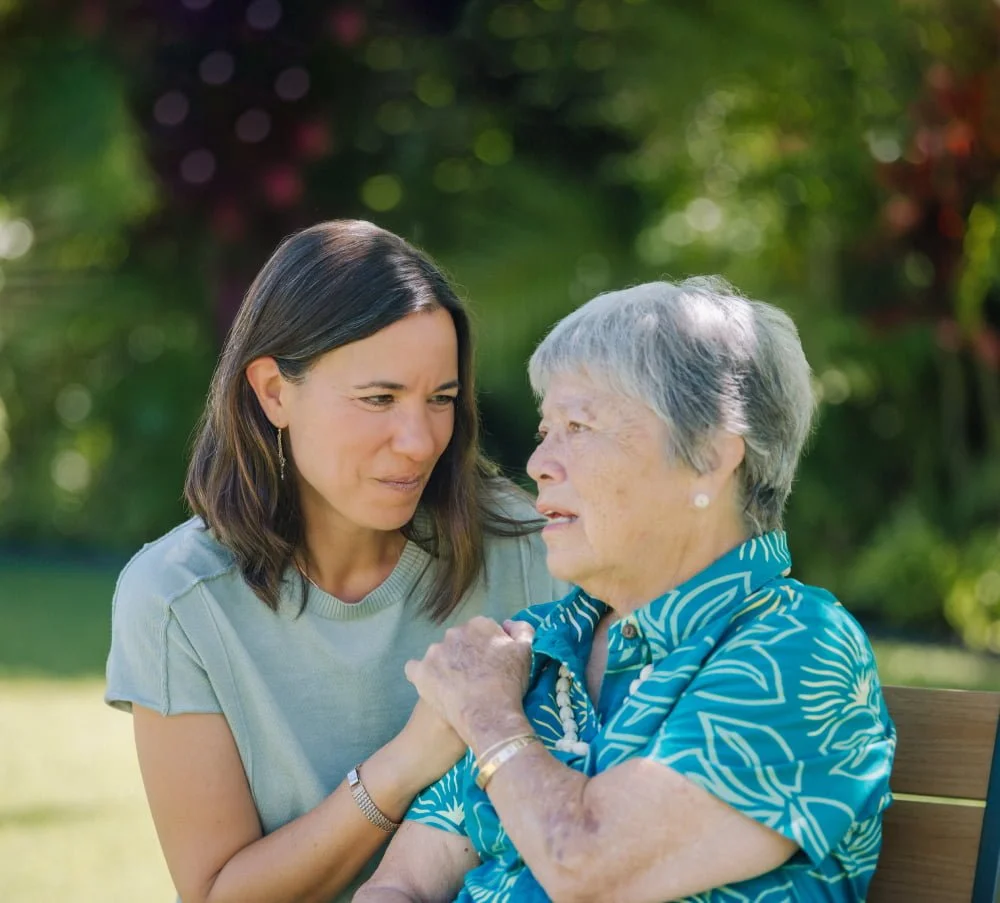 Lani Hubbard sharing a warm moment with a family member in the garden