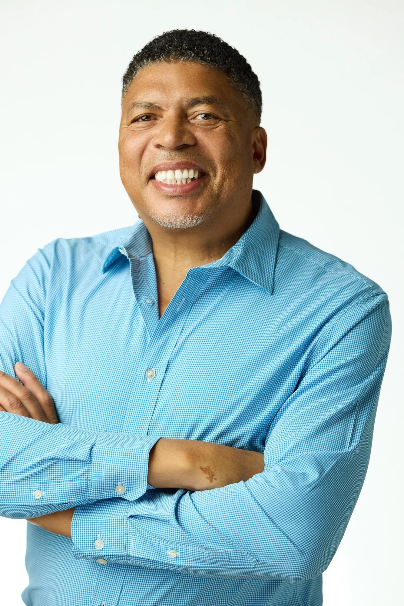 Senior executive headshot on white background, on-location session at 200 Park Avenue, New York