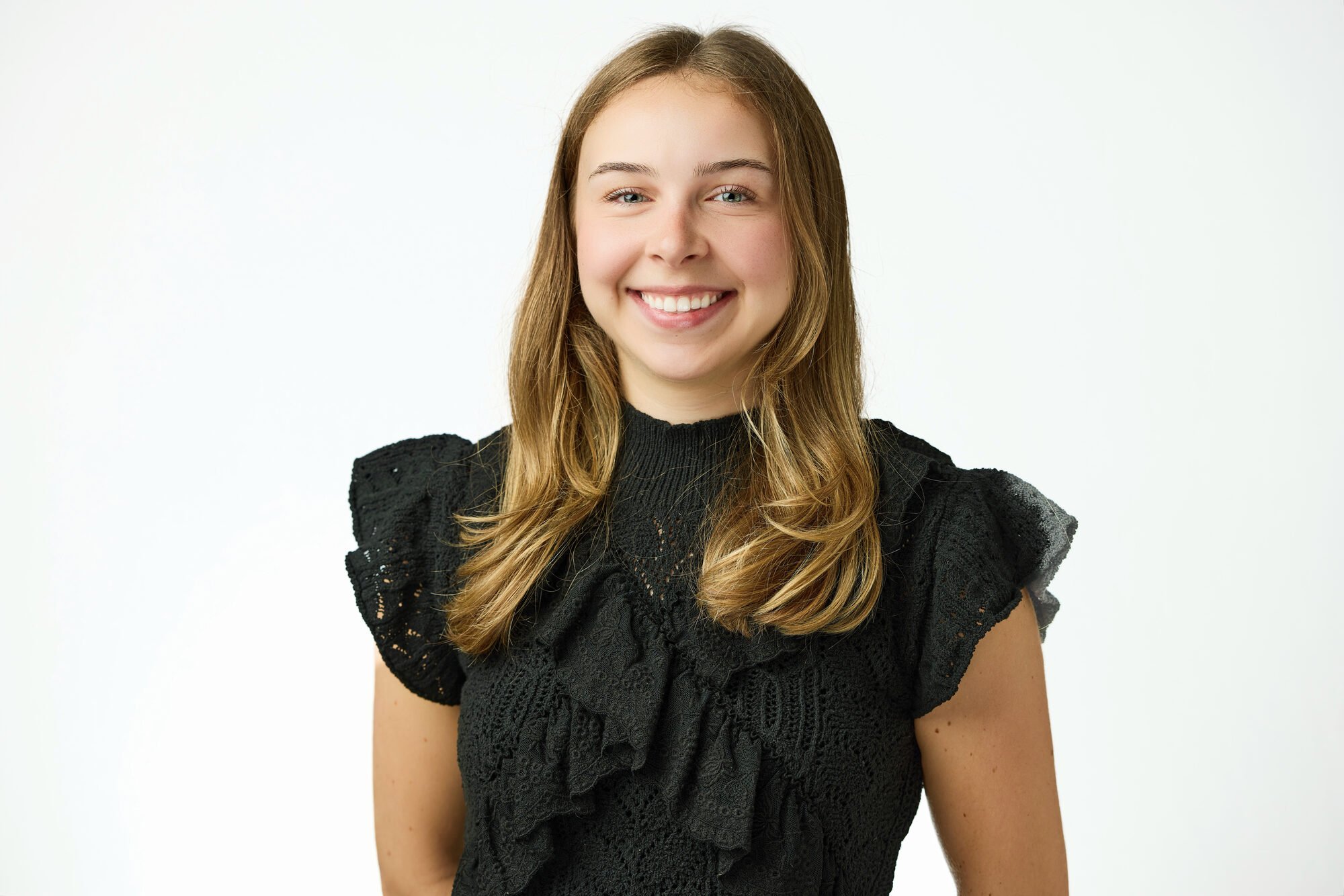 Professional headshot on a clean white background, New York corporate team session