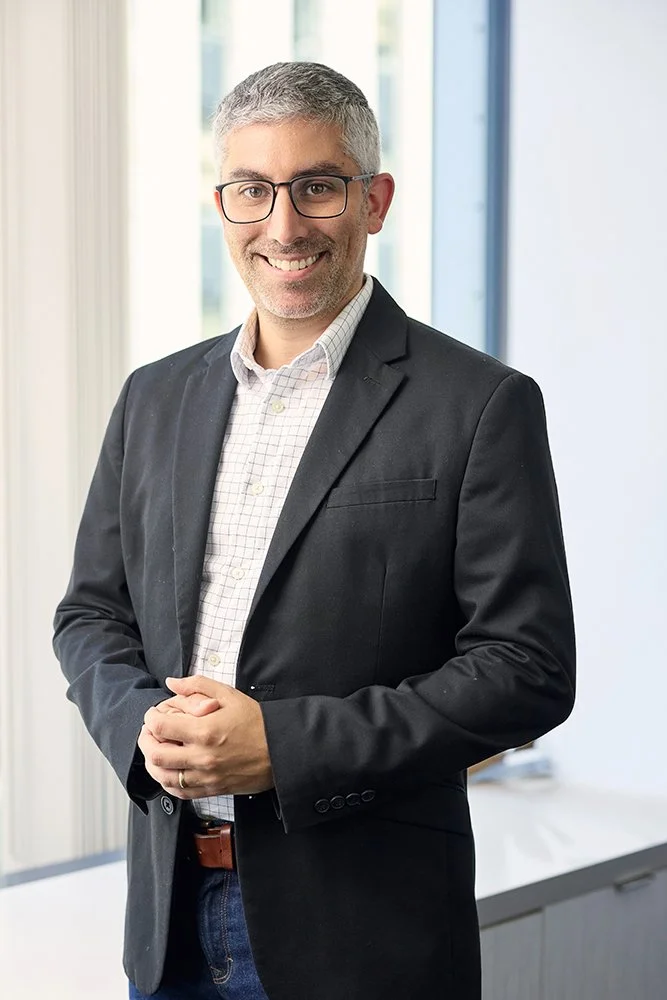 Corporate executive headshot in a modern office