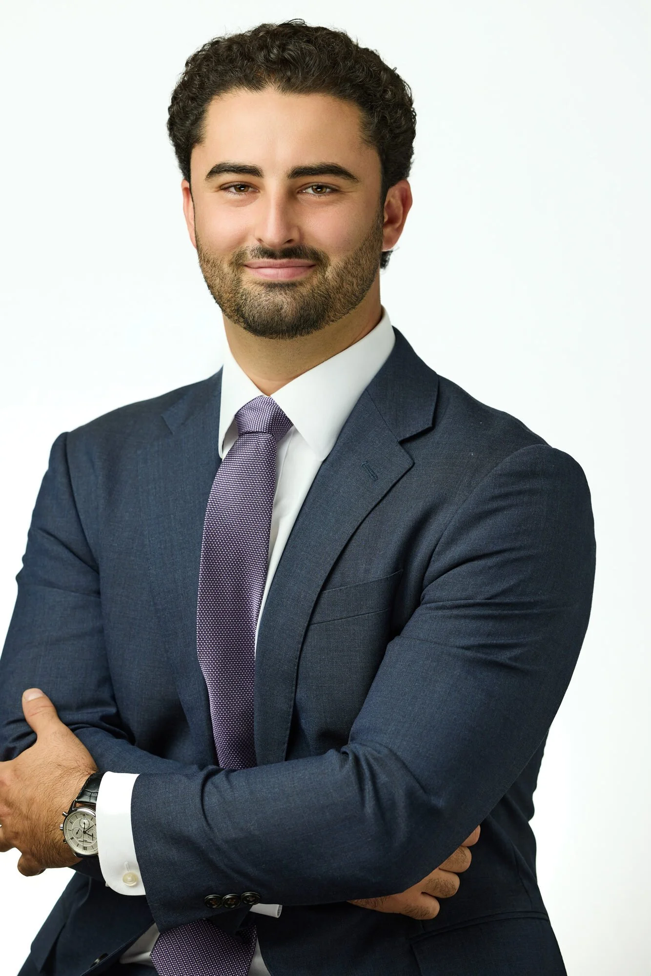 Executive headshot in navy suit and tie, photographed at 200 Park Avenue, Manhattan