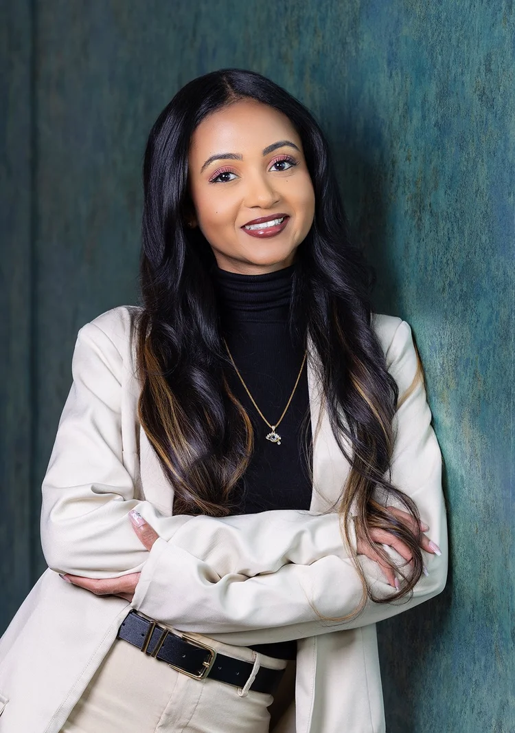 Lifestyle business portrait of a woman in a white blazer