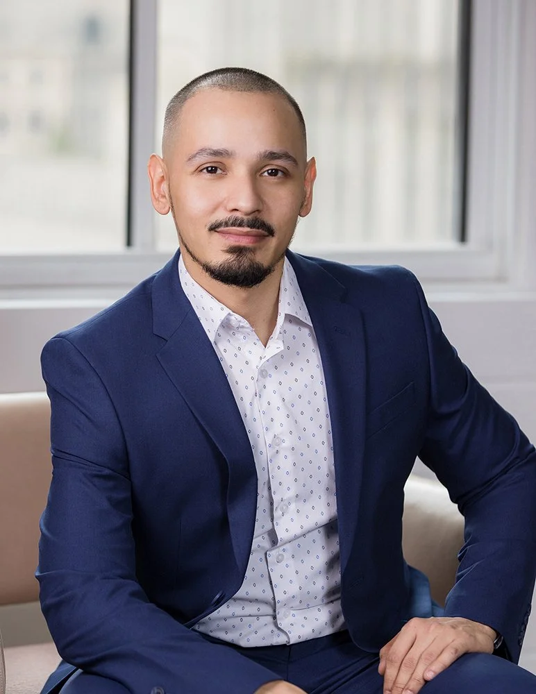 orporate headshot of a professional in a navy suit, by Blue Sky's Studio