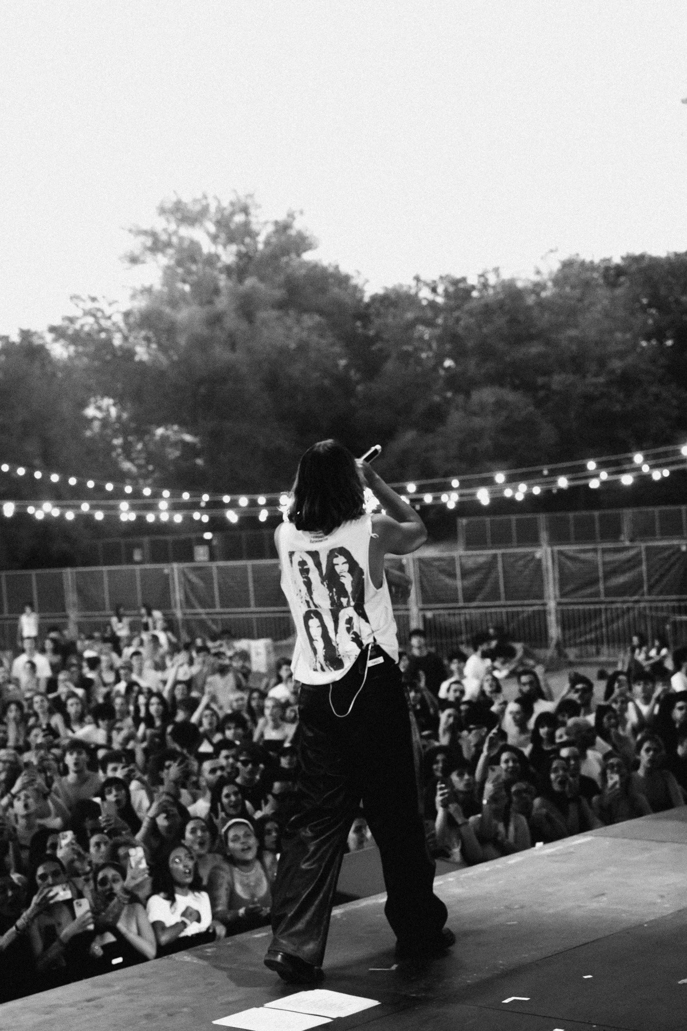 Fares of musical group bnkr44 performing in Flesh & Spirit tank top.