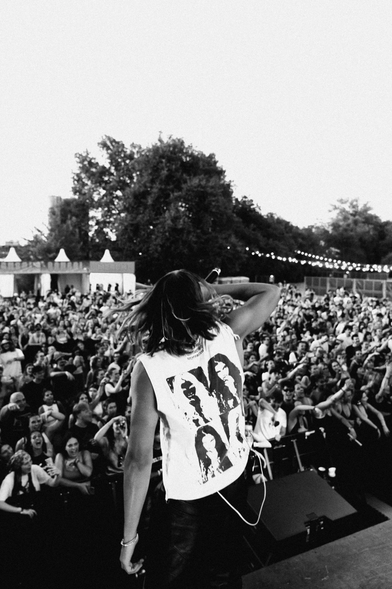 Fares of musical group bnkr44 performing in Flesh & Spirit tank top.