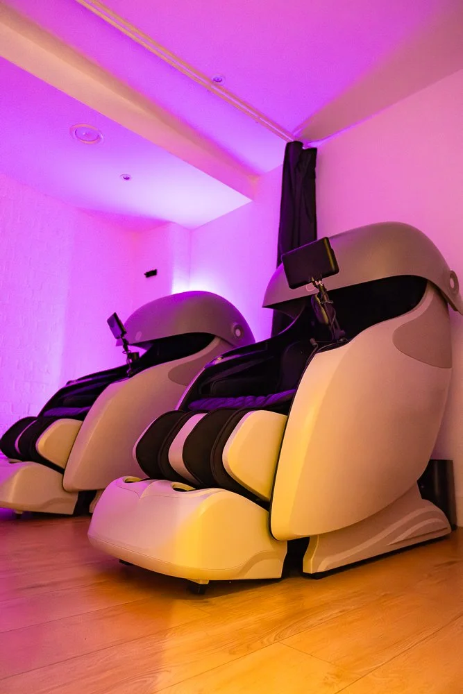 Image showing Recovery Cave's Zero Gravity massage chairs.