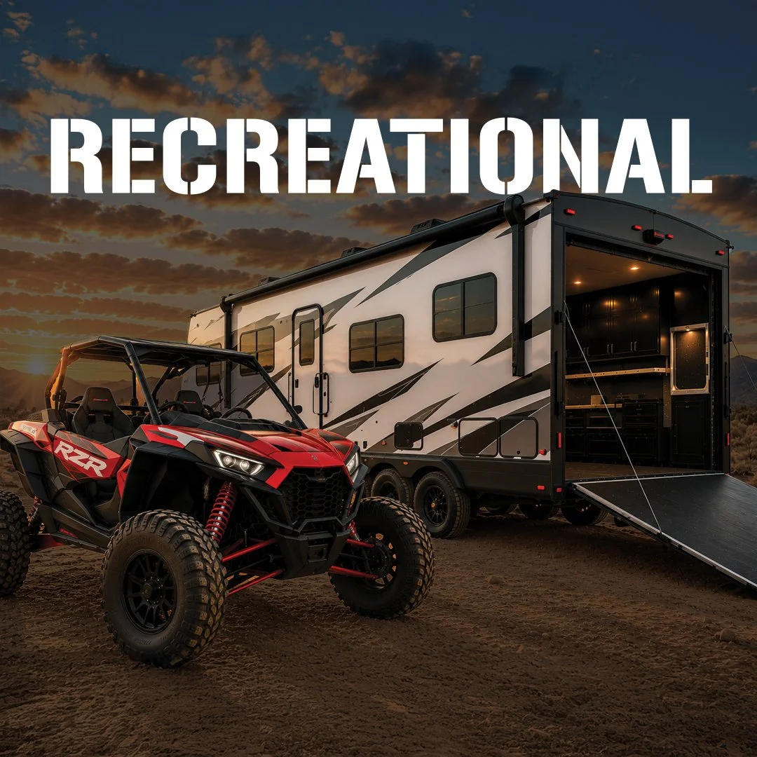 A recreational vehicle with an open trailer door and a red off-road ATV vehicle parked in front during sunset, with the word 'RECREATIONAL' overlayed at the top.