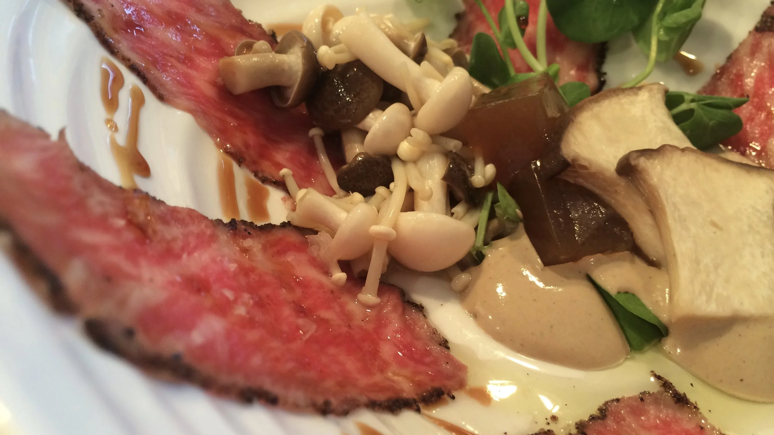 Wagyu Carpaccio, Indonesian Long Pepper, Porcini Foam, Marinated King Oyster and Shimeji Mushrooms, Shiitake Gelée