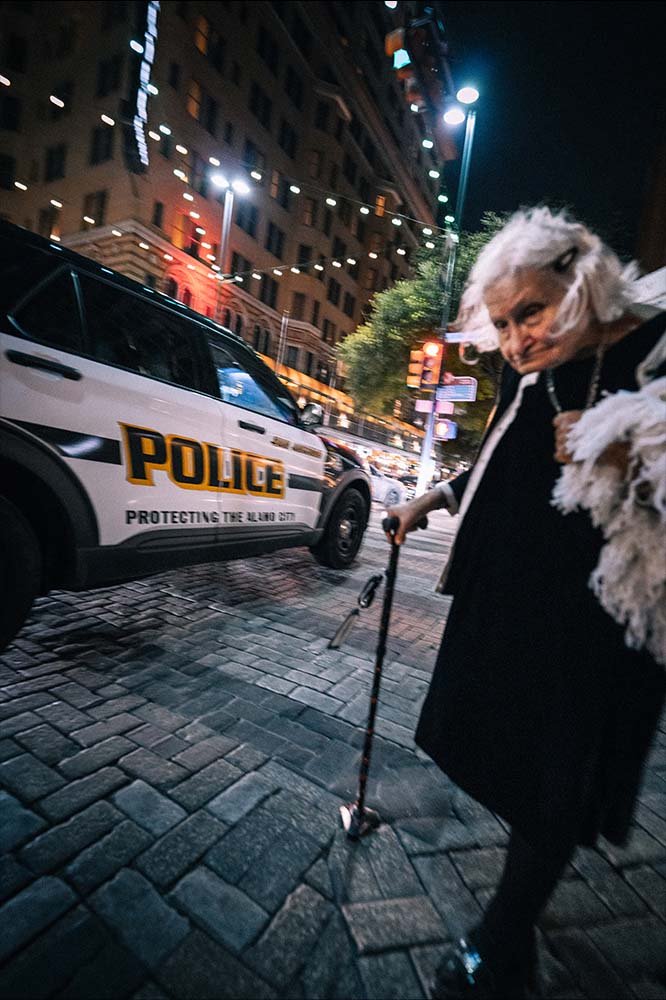 Old lady walking past the police REDUCED FILE SIZE.jpg