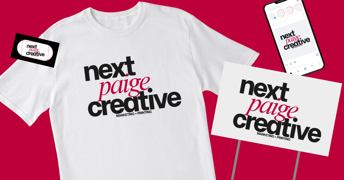 White t-shirt with black and pink text reading "next paige creative," surrounded by a business card, a smartphone, and a sign with the same logo on a red background.