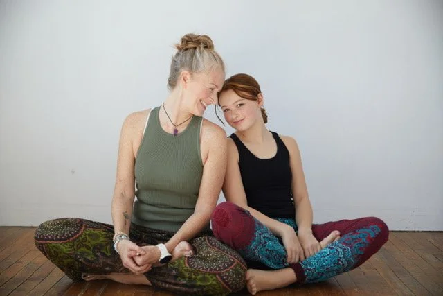 Tanya founder of rooted yogi.ca guiding children's yoga through play, joyful movement and curiosity.