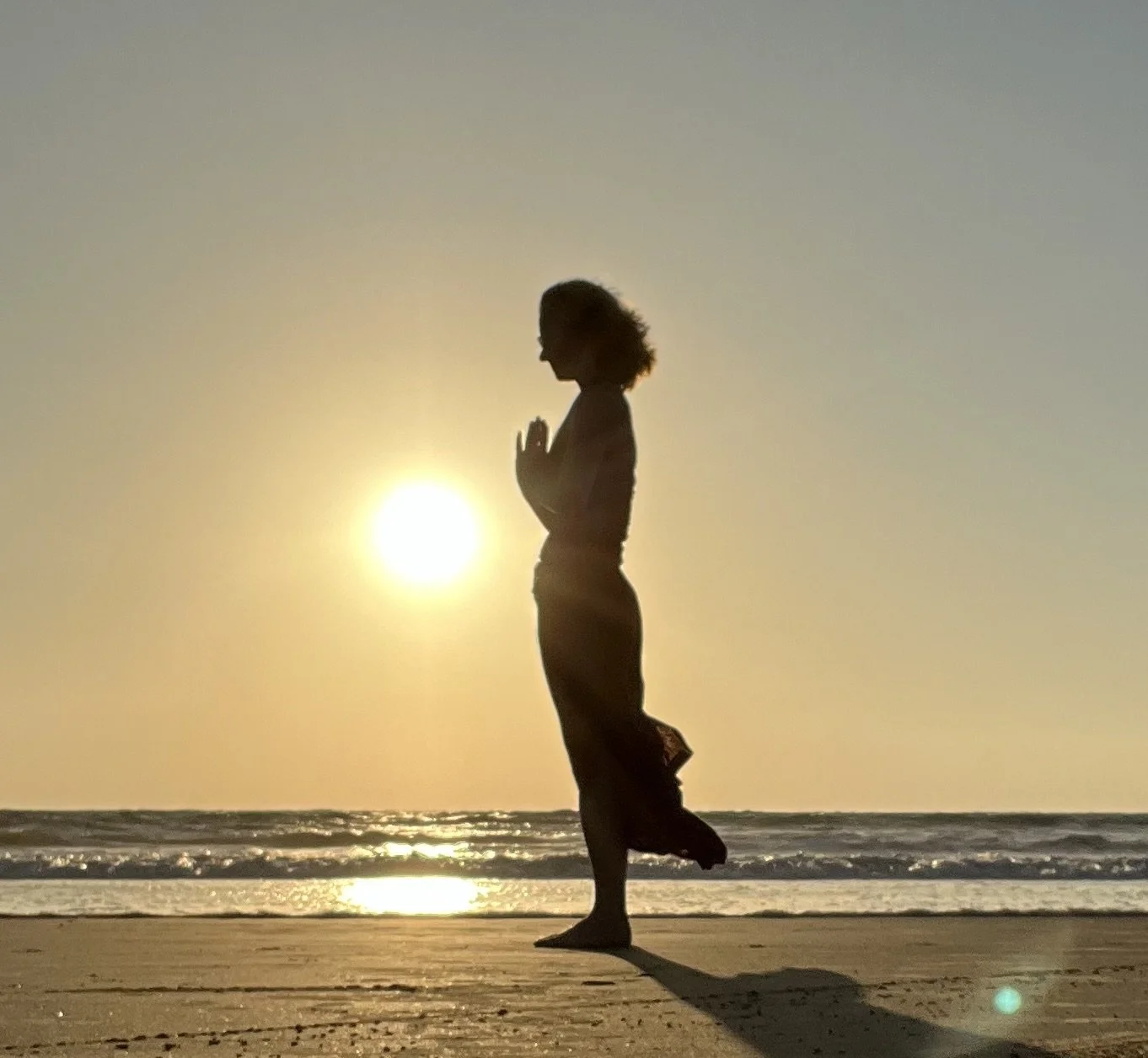 Tanya Johnson, founder of Rooted Yogi, quiet moment of somatic yoga at sunset reflecting rooted yogi.ca belief that healing begins with stillness and acceptance