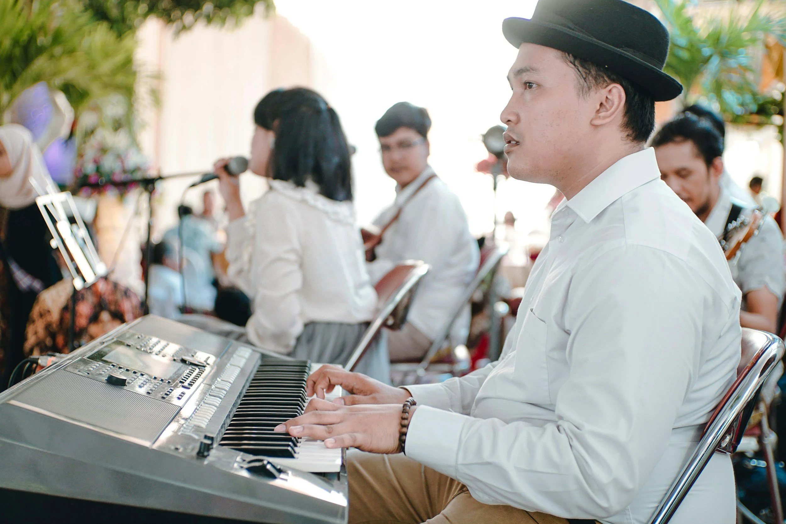 Guests dancing to live music at an intimate outdoor reception.