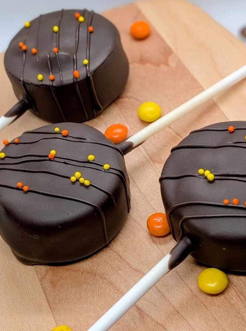 Peanut Butter cake pops with peanut butter buttercream and Reese's Pieces filling