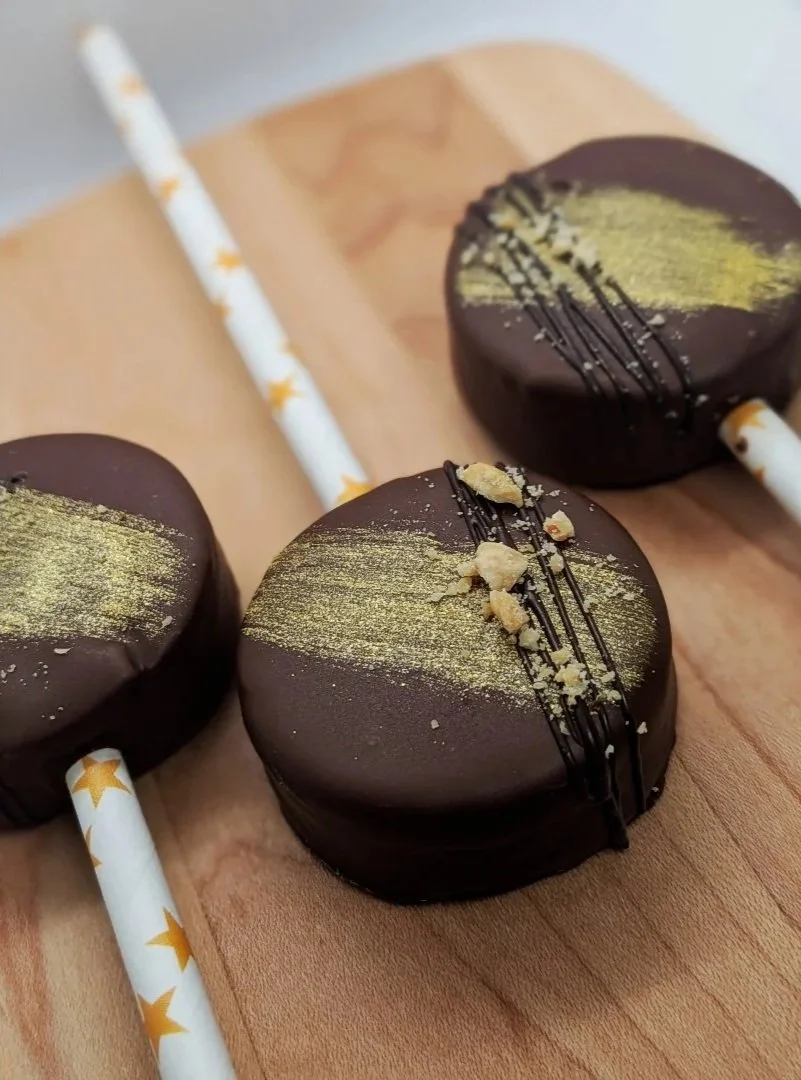 Peanut Butter cake pops with edible gold glitter paint and chocolate drizzle with chopped peanuts