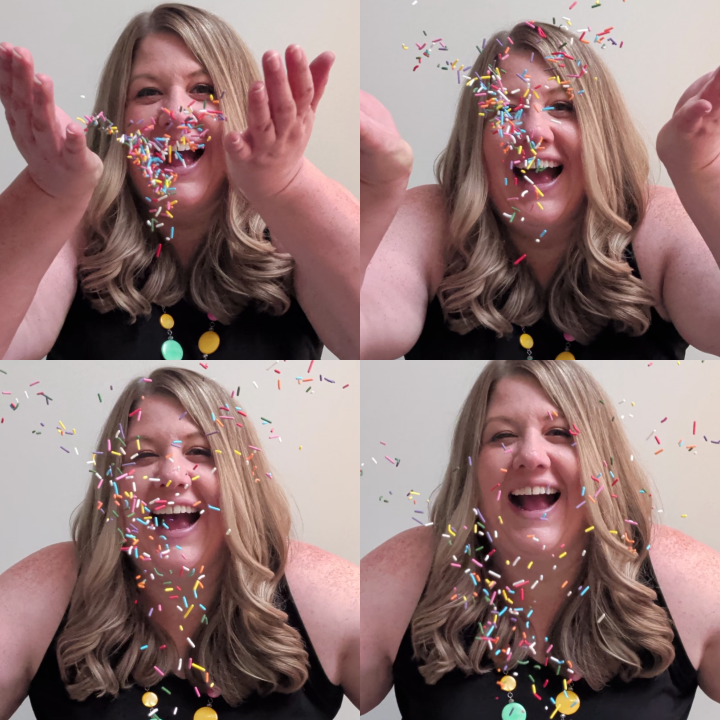 A woman celebrating with colorful sprinkles falling around her, smiling and joyful.