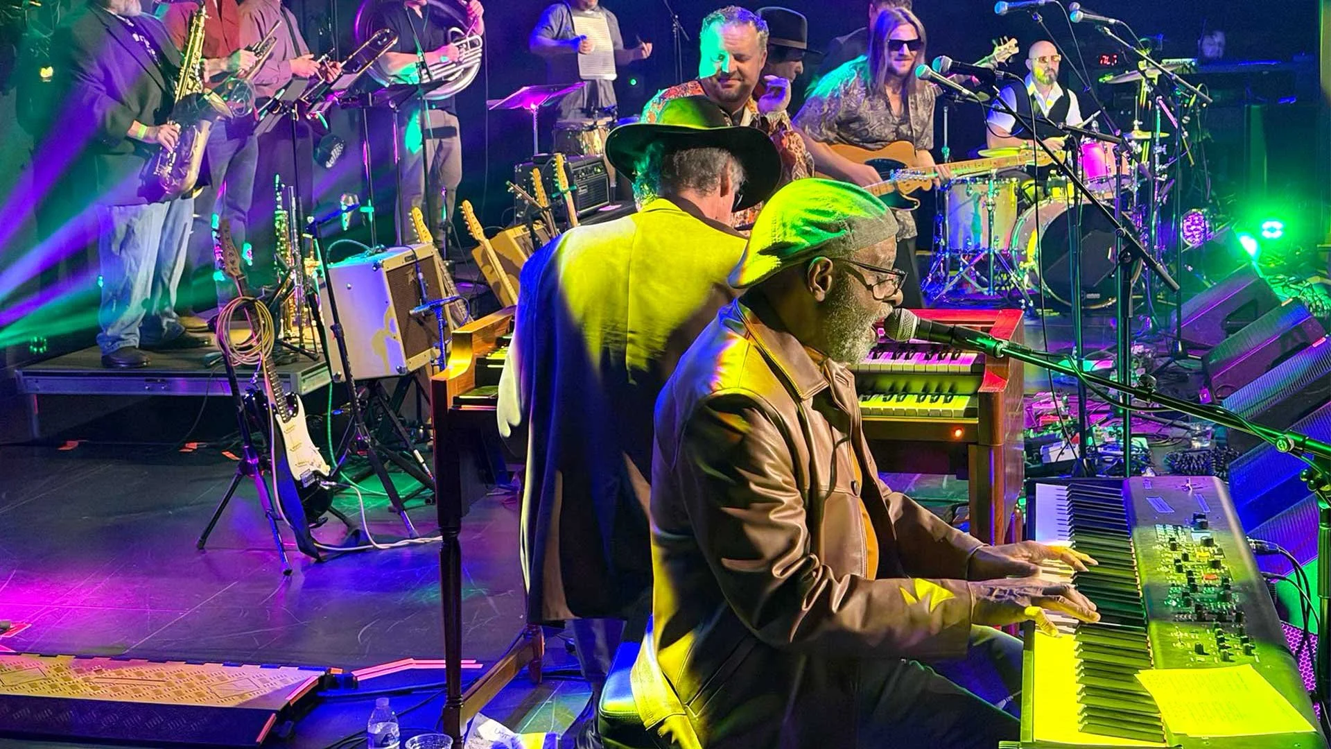 Phil Donaldson onstage with musicians playing keyboard and singing at "The Last Waltz (Again) show. Photo by David Vacek