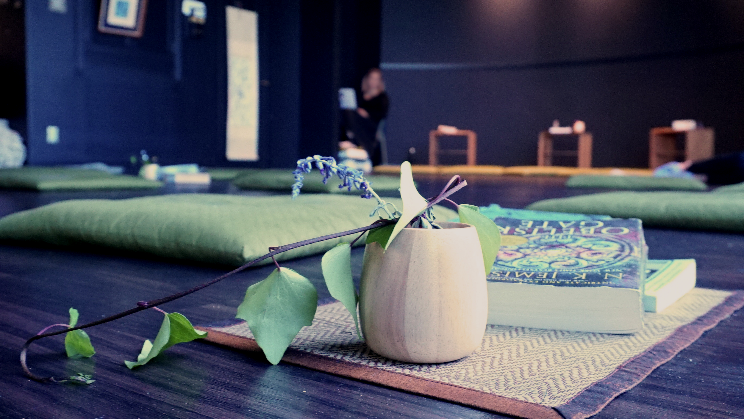 Small vase and flower on the low table in the arrival space, where visitors removed their shoes and were welcomed with matcha tea.