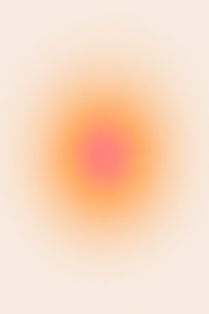 Une image floue avec des couleurs dégradées allant du beige au rose et orange au centre.