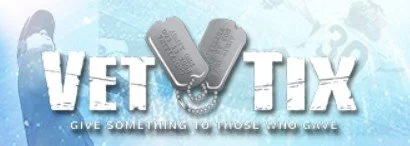 Logo for Vet Tix with the text 'Give Something to Never Forget' and images of dog tags.