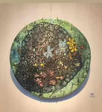 Circular artwork with a dark center filled with garden insects like ladybugs and butterflies, surrounded by a green border with foliage and flowers.