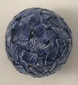 A sphere made of ceramic pieces.