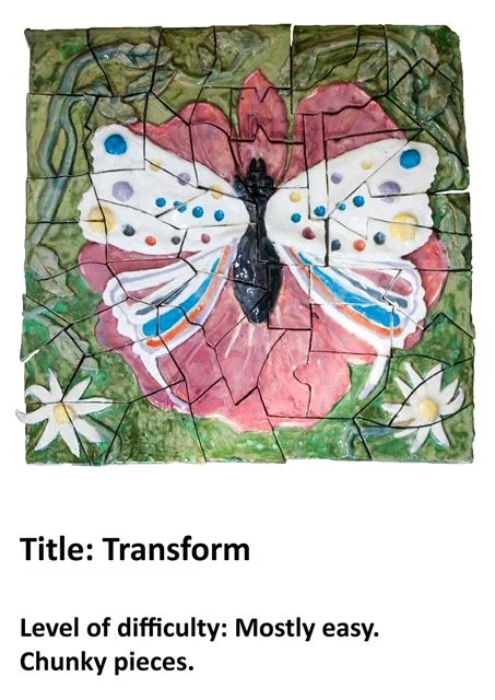A puzzle image depicting a butterfly with colorful wings, set against a red and pink background, with green foliage and white flowers in the corners.