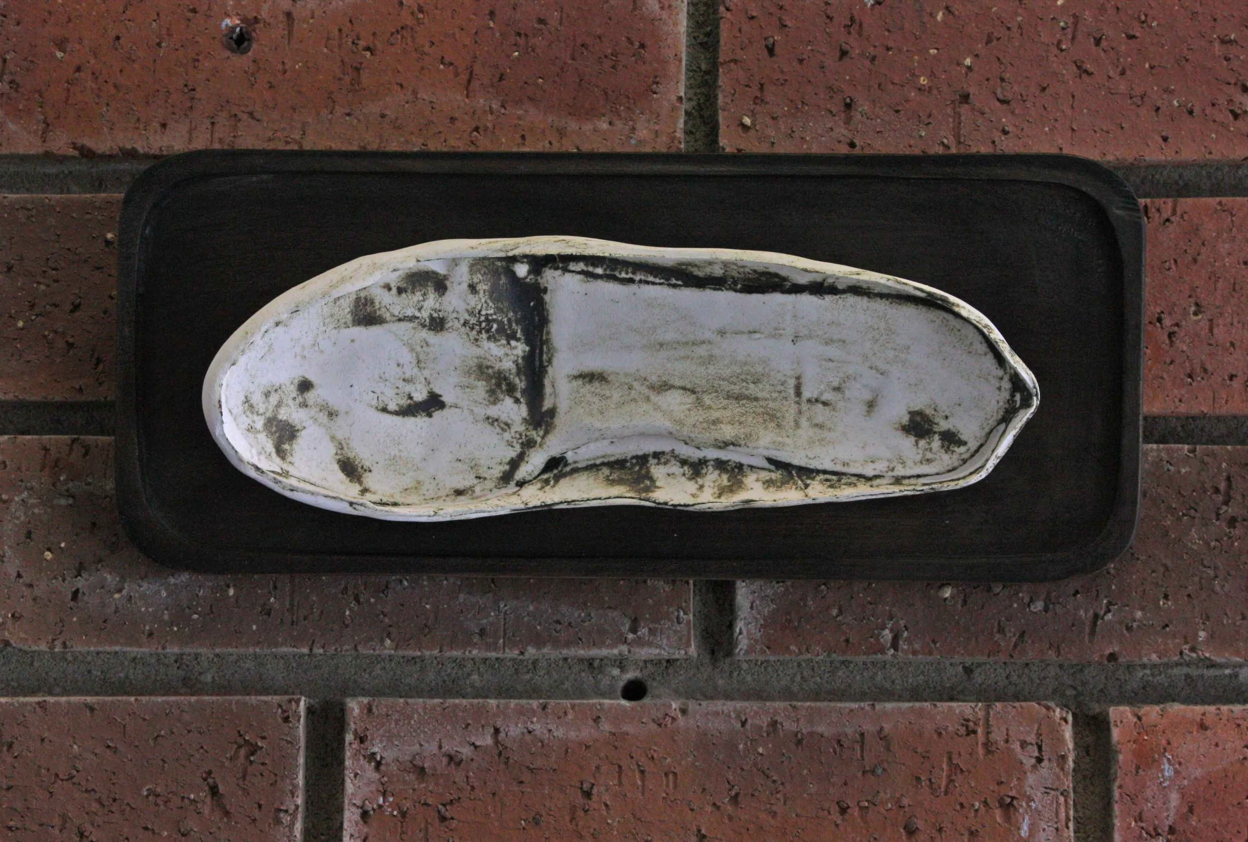 a footprint mounted on a small board