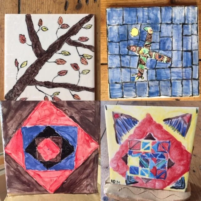 Four abstract watercolor paintings on paper: top left shows a tree branch with leaves, top right depicts a person in green clothing with arms and legs outstretched on a blue grid background with two yellow circles, bottom left features concentric diamond shapes in red, blue, black, and brown, bottom right displays a geometric pattern in red, blue, yellow, and green with the initials "URM".