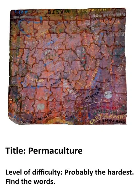 A jigsaw puzzle with a colorful, artistic design related to permaculture. The puzzle features words and images embedded in vibrant, abstract artwork.