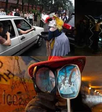 A woman in old-fashioned dress and bonnet interacts with a car driver amid traffic, holding an umbrella; close-up of a person with reflective goggles showing a street scene at sunset.