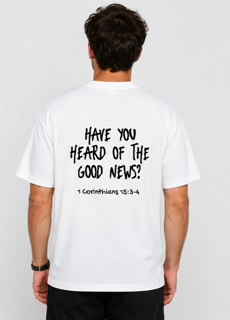 Back view of a man wearing a white T-shirt with a biblical quote from 1 Corinthians 15:3-4 written in black text.
