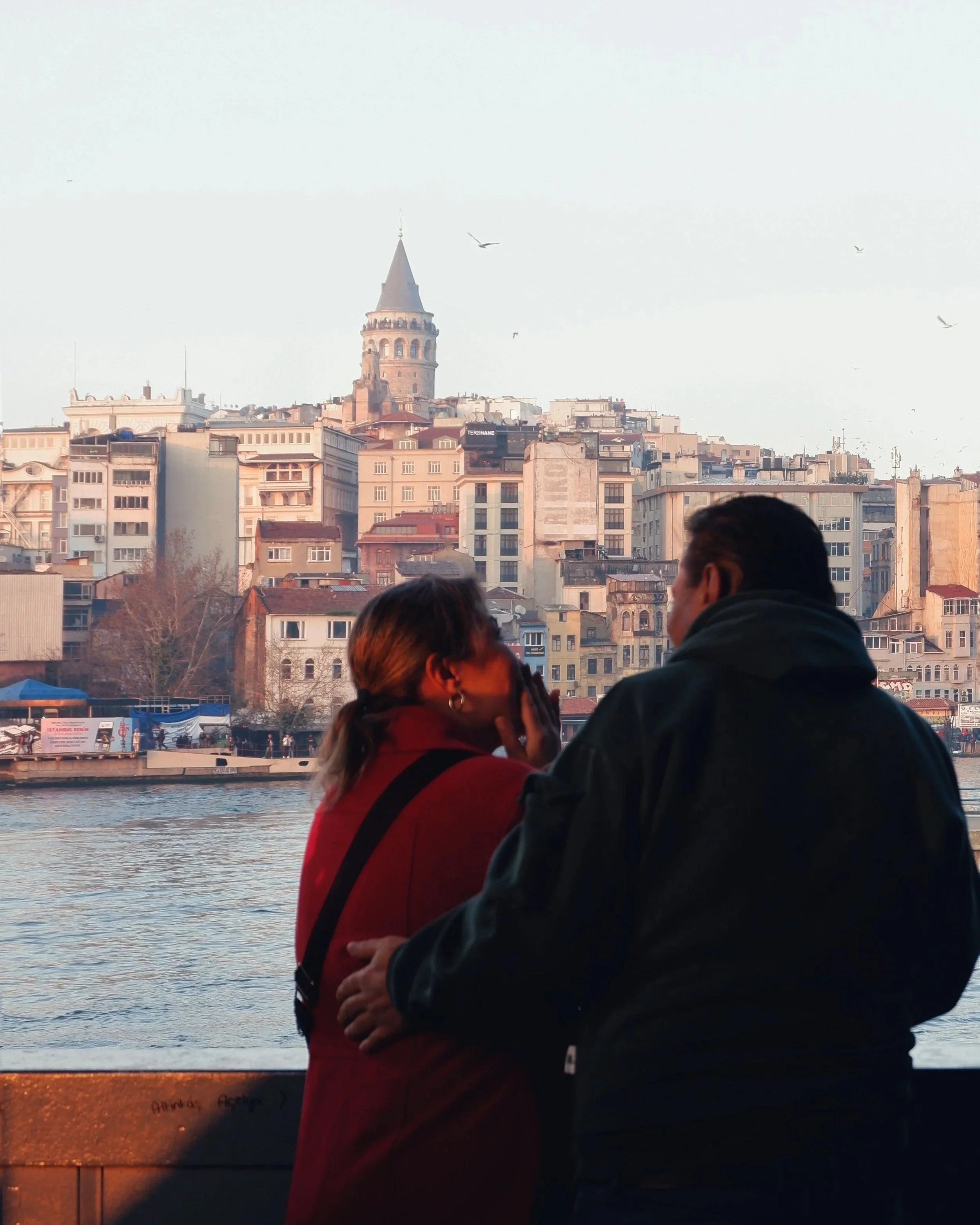 Couples looking across the river and sharing a moment