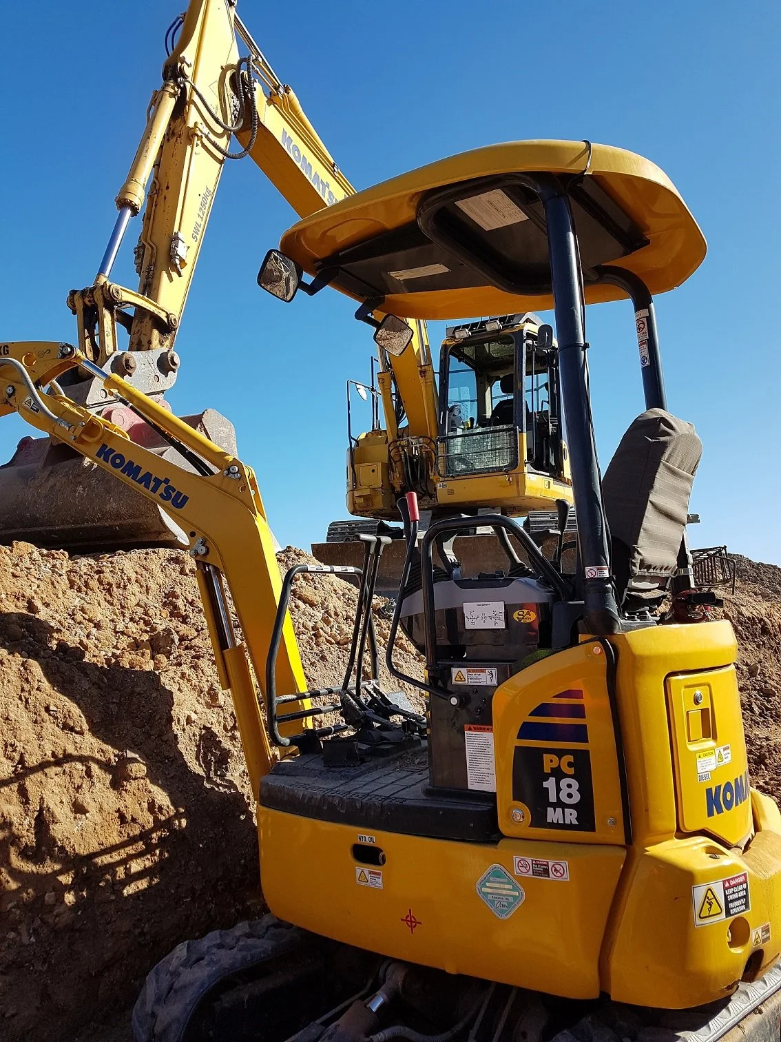 Backyard clearing and earthmoving to create a level, usable outdoor space.