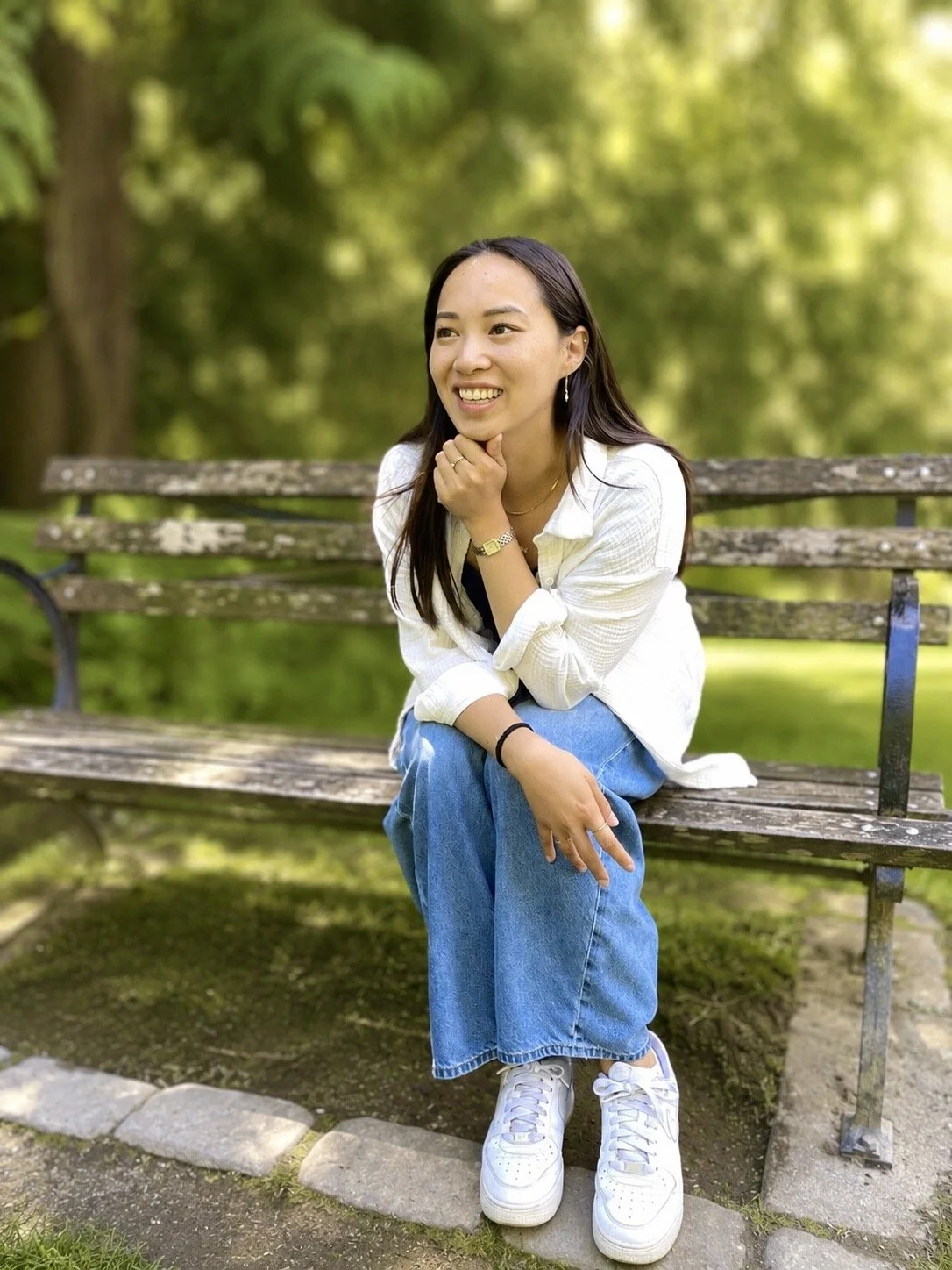 A photo of Leann sitting on a park bench