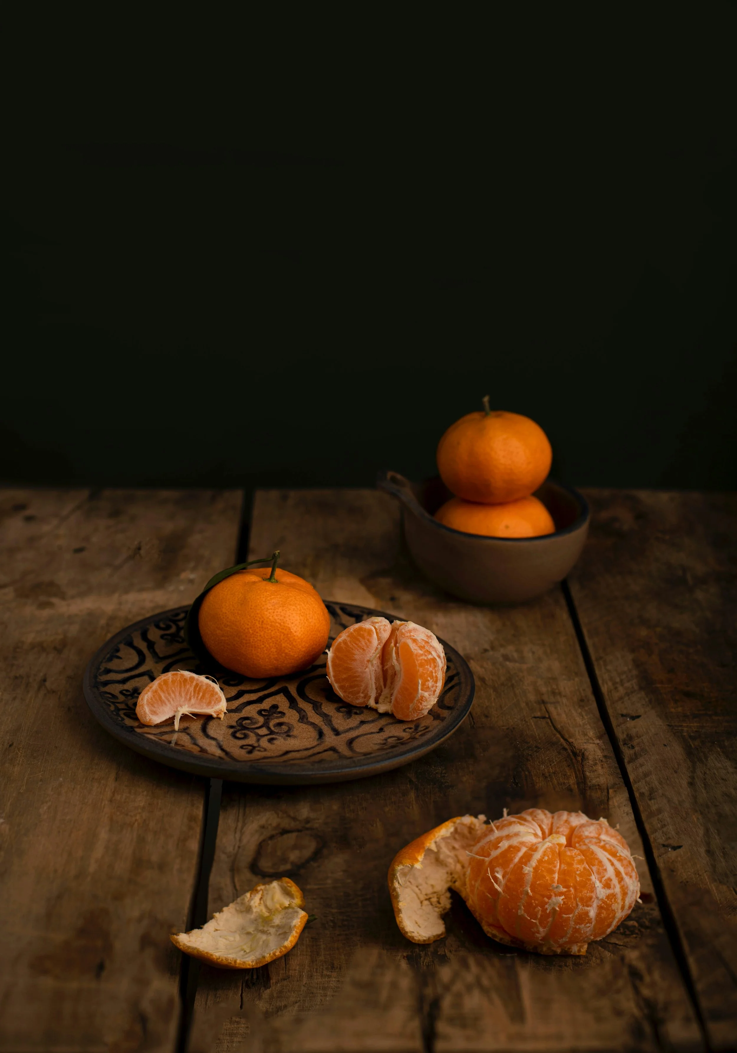 peeled tangerines on a wooden table