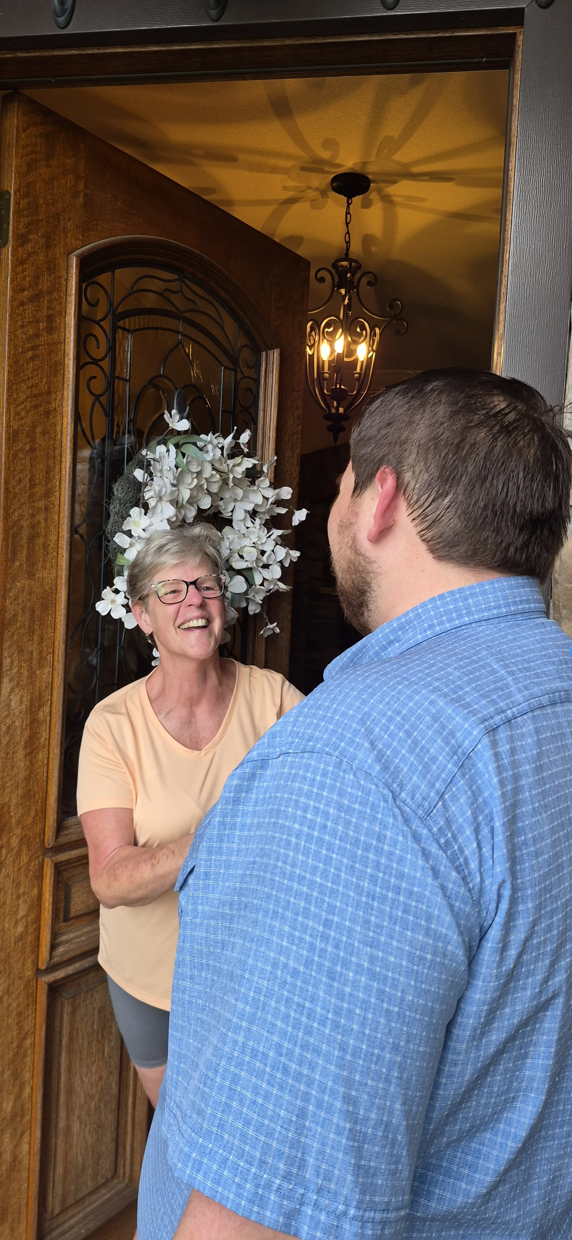 Happy Customer shaking hand with Owner of Abbott Home Improvements