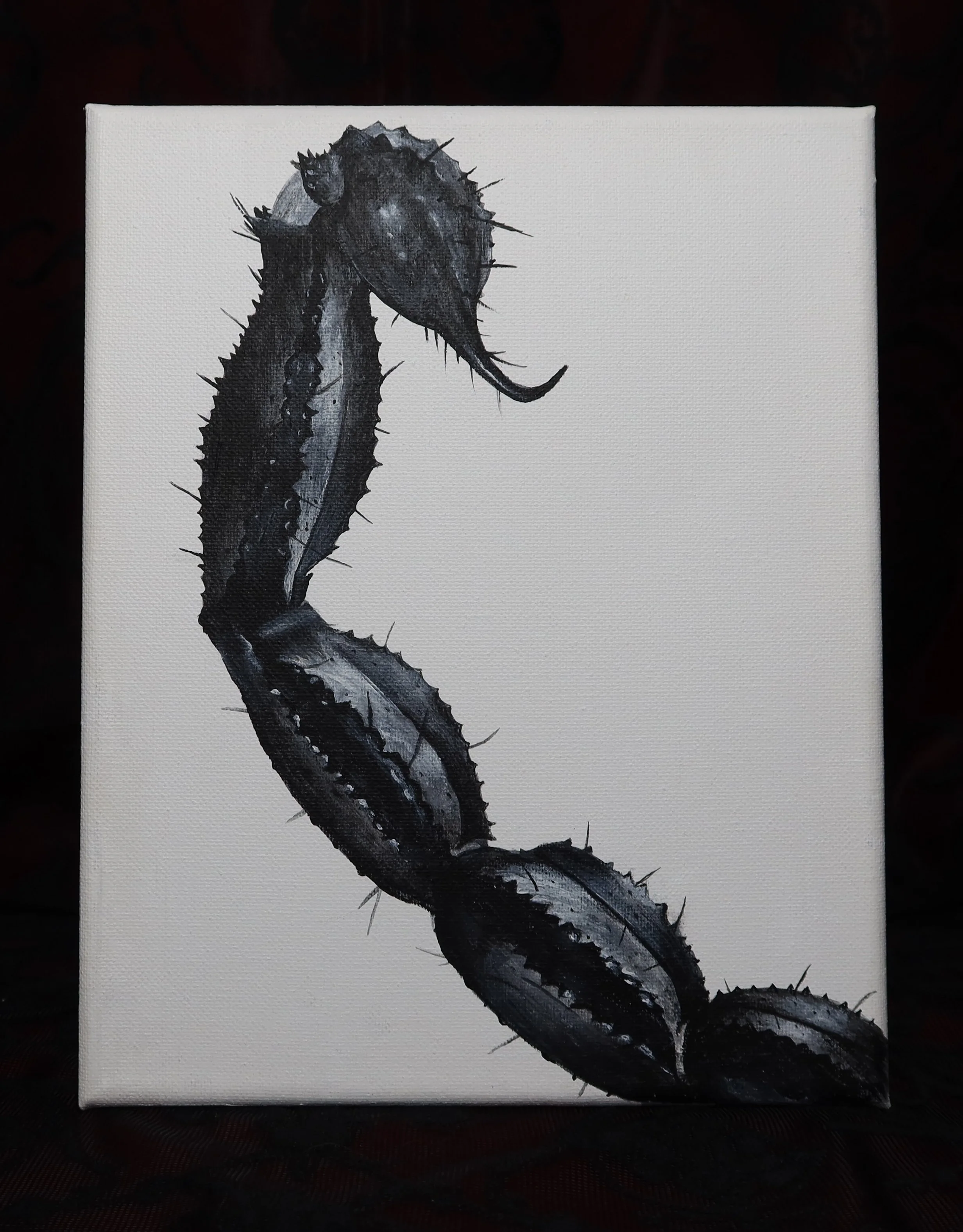 Black and white painting of a scorpion tail on a white canvas.