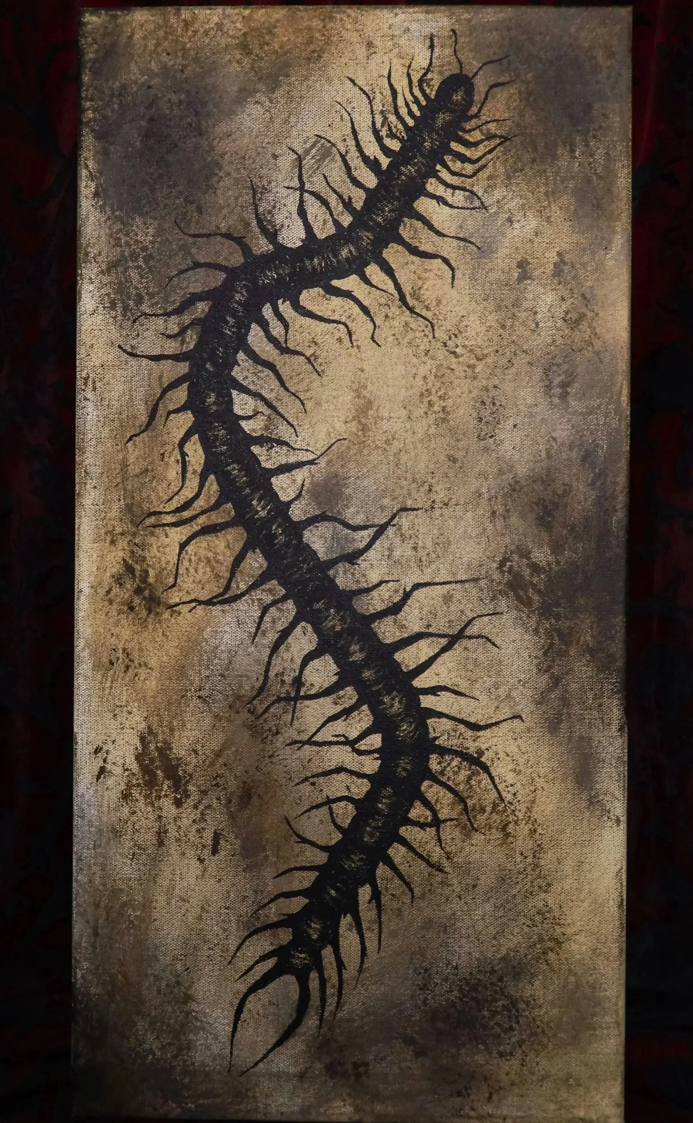 A painting of a black centipede with numerous legs on a textured beige and brown background.