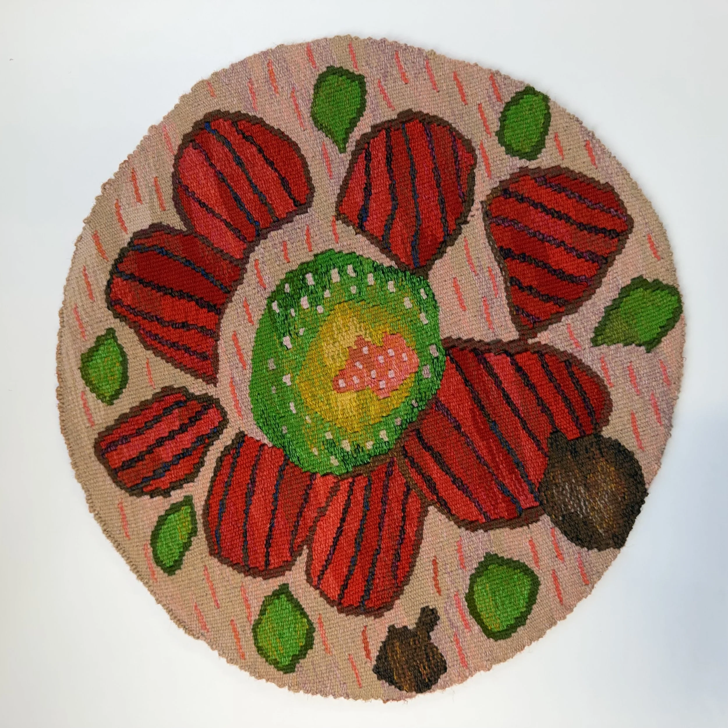 Close-up of a circular woven tapestry piece, woven for Banksia house at Radford College.