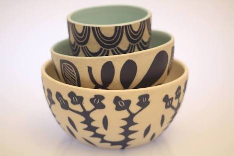 Dimity Kidston sgraffito hand carved bowls with floral and geometric patterns.