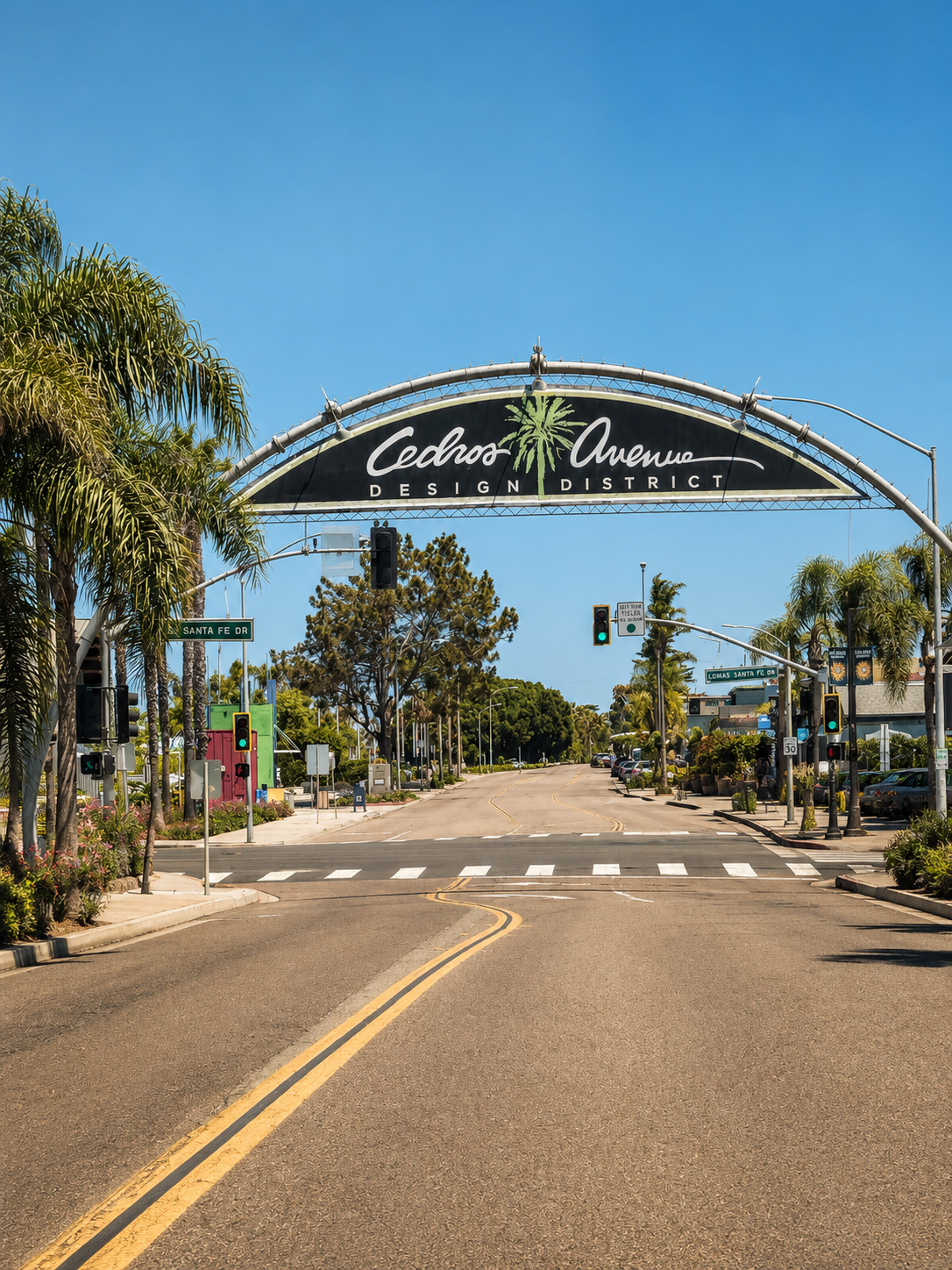 Cedros Avenue Design District in Solana Beach, California, featuring the iconic entrance sign, palm-lined street, shops, and coastal neighborhood atmosphere.