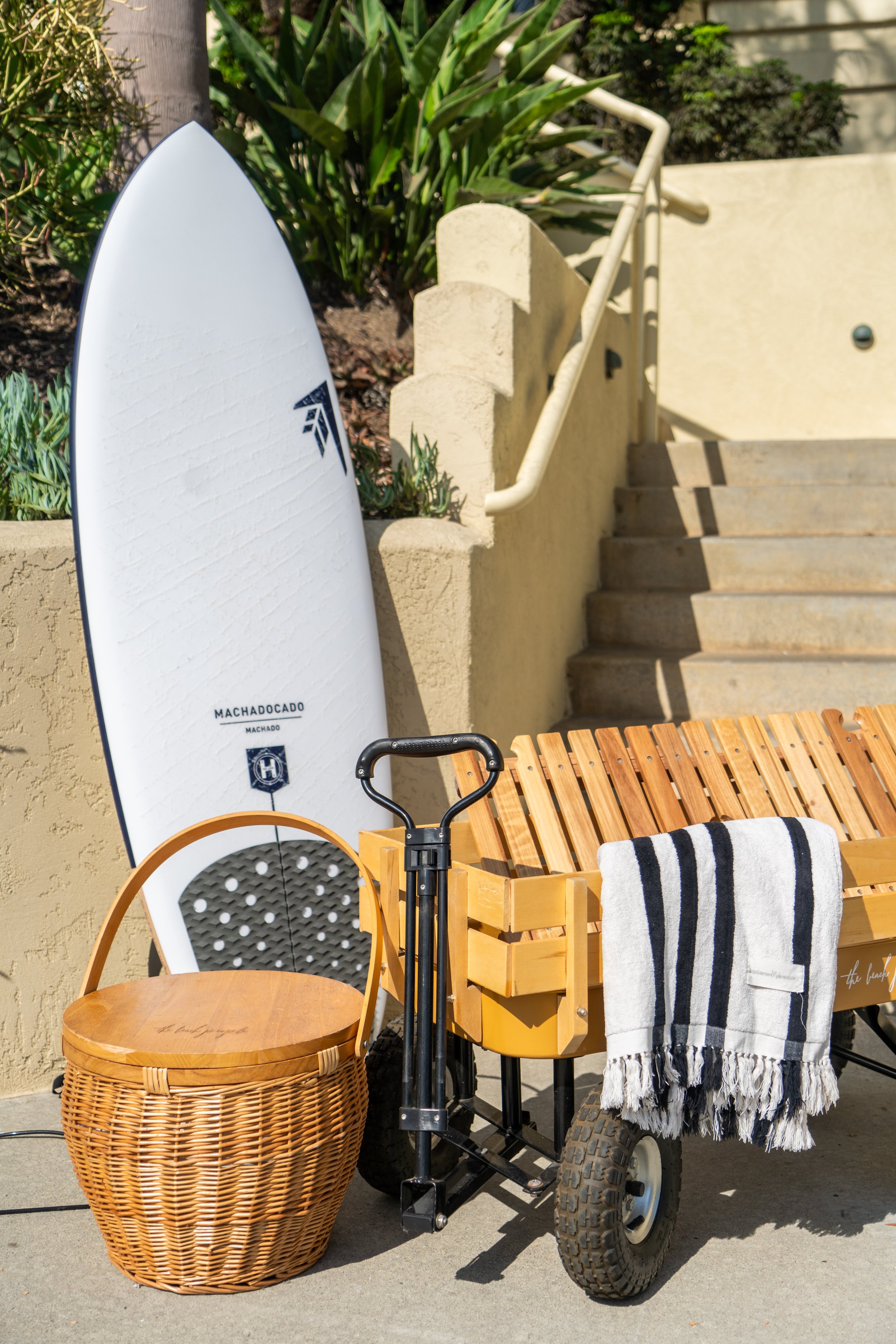 Machado surfboard available for beach days at The Solana House, a luxury coastal vacation rental in Solana Beach, California