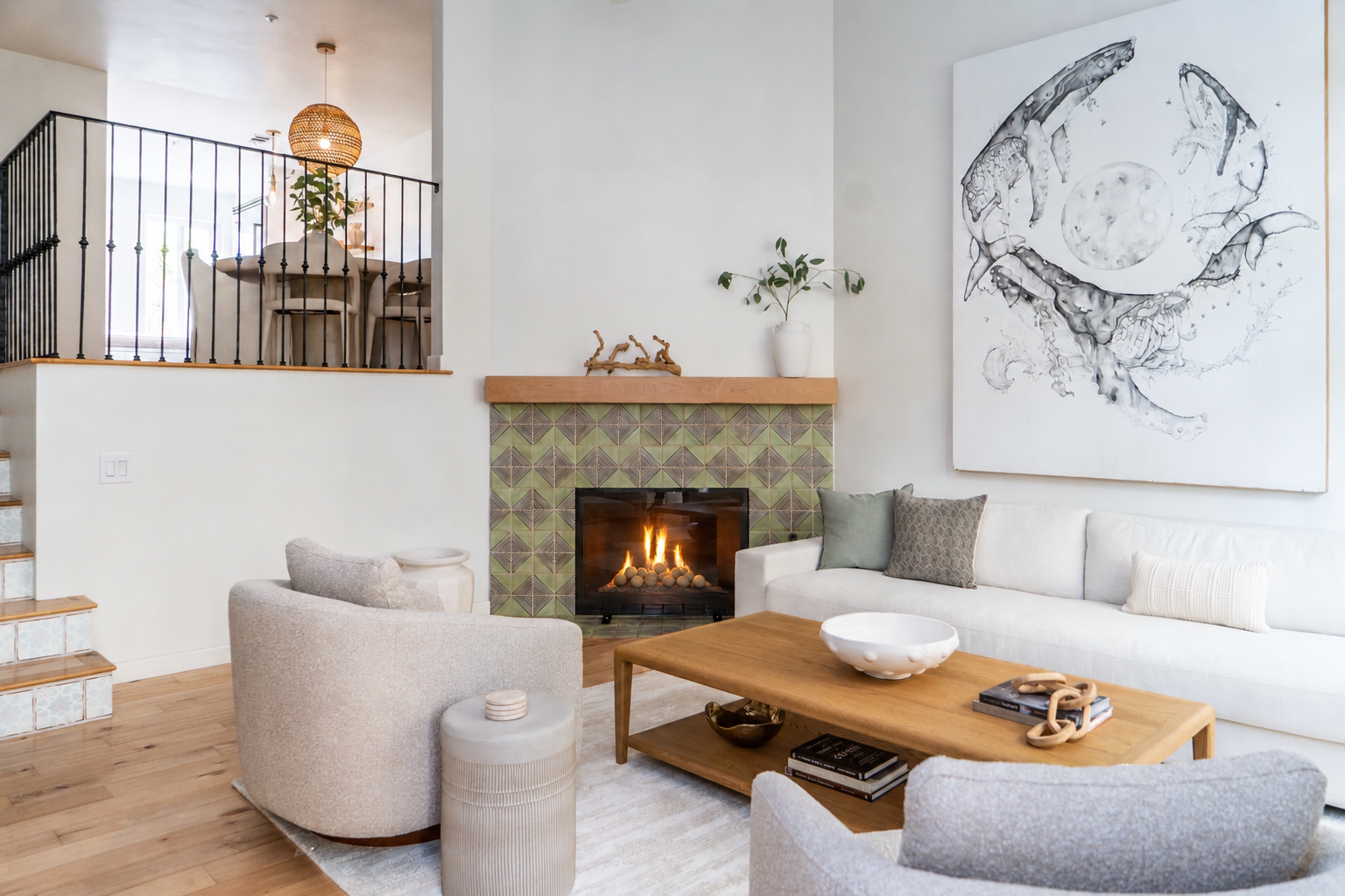 Cozy living room at The Solana House in Solana Beach, California, featuring a fireplace, comfortable seating, warm wood accents, and coastal-inspired decor.
