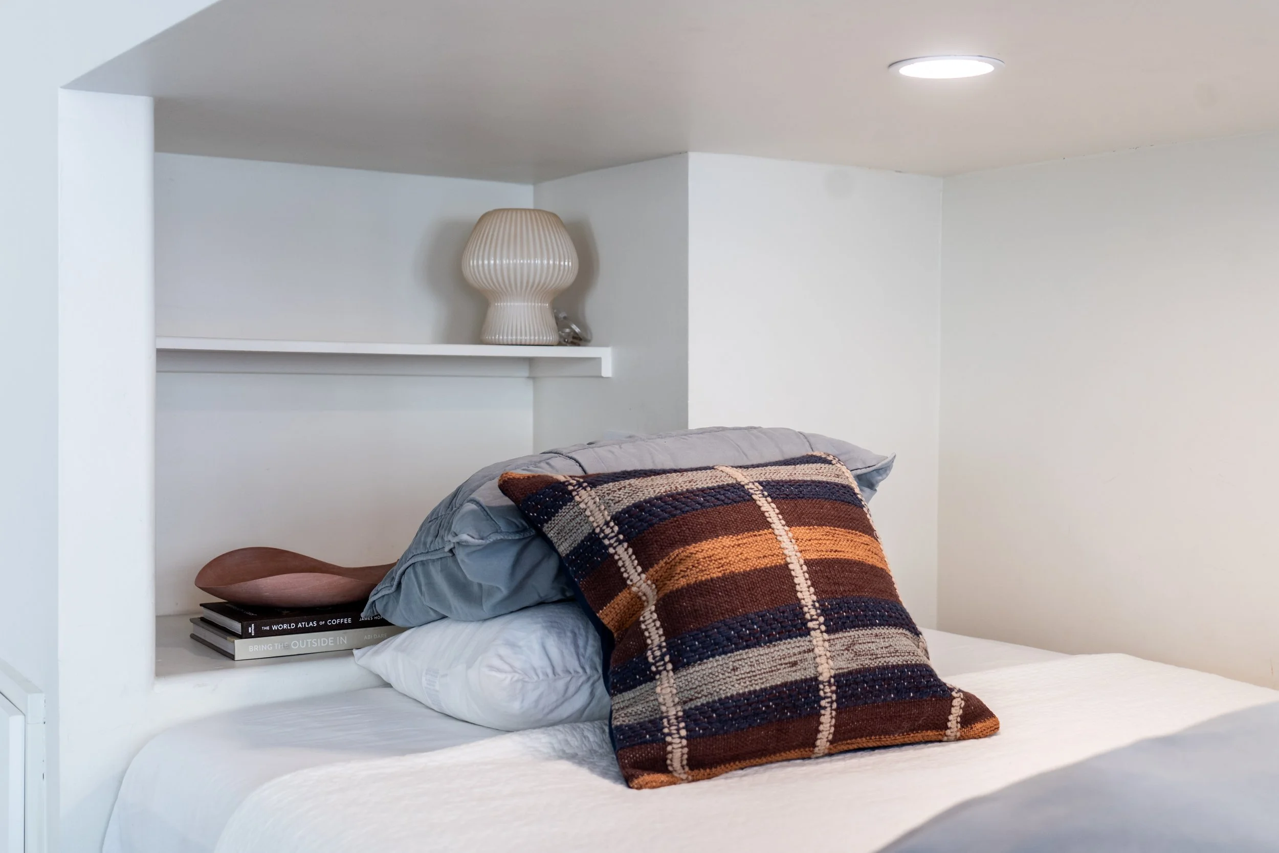Thoughtfully styled built-in bunk bed with cozy bedding and curated details at the Solana House.