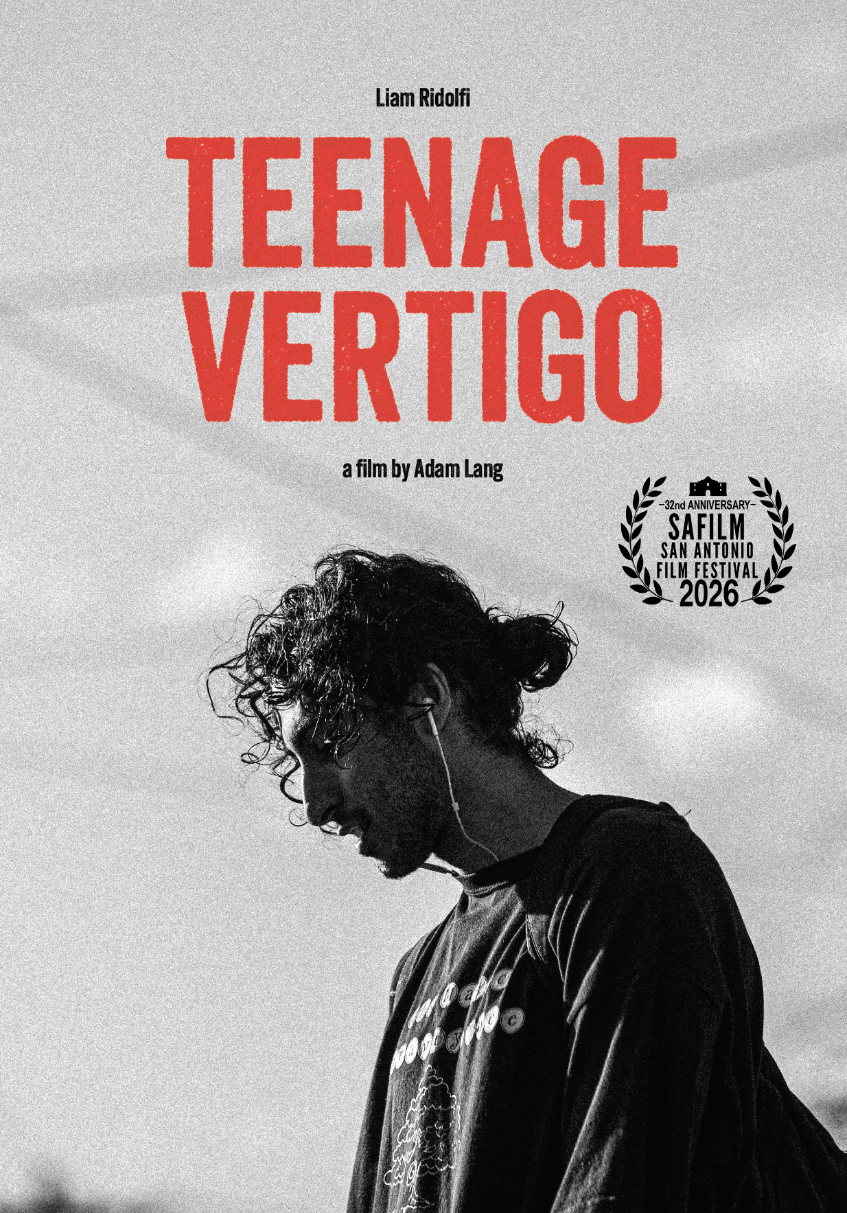 Black and white promotional poster for the documentary film 'Teenage Vertigo' by Adam Lang, featuring a profile photo of a young man with curly hair, wearing earphones, with text indicating it was part of the 32nd San Antonio Film Festival in 2026.